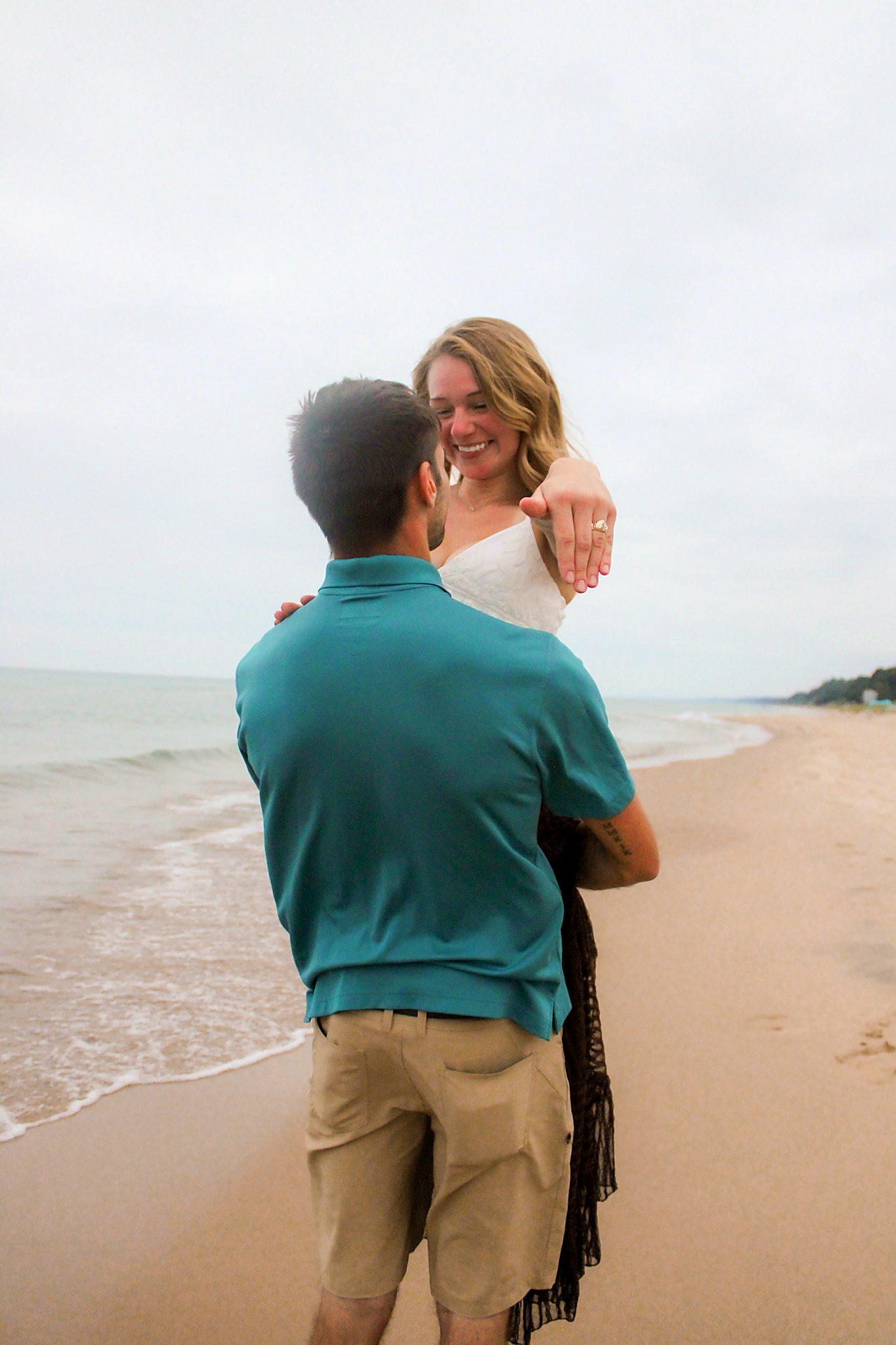 Engagement ring reveal along the Lake Michigan shoreline