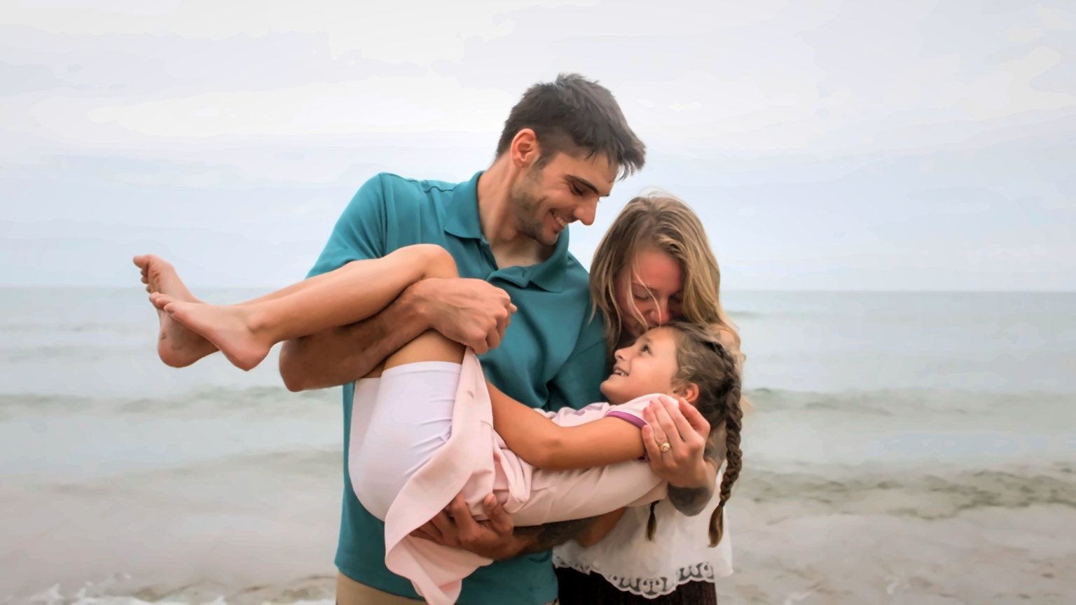 Family laughing together near the Lake Michigan shoreline